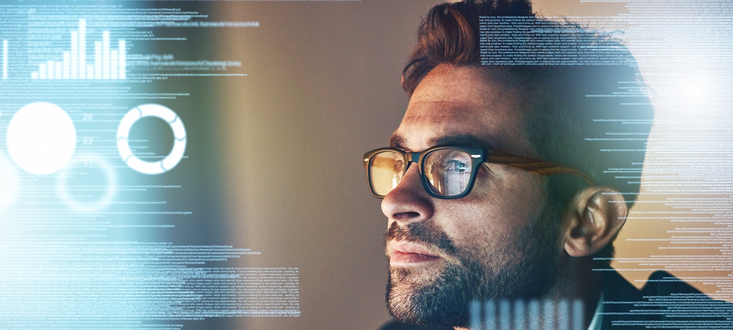 Man looking at data visualizations while working as an applied statistician.