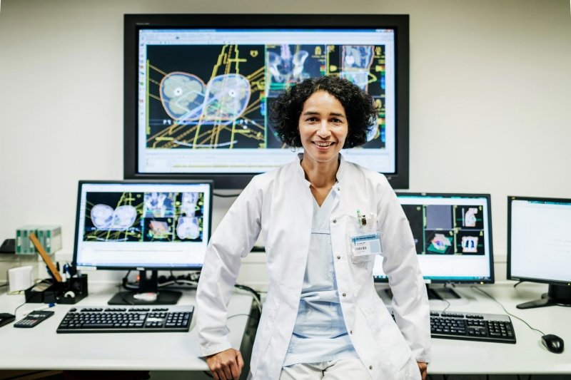 Medical Professional in front of computers.