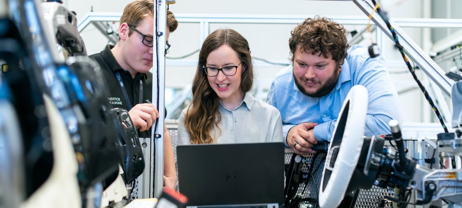 Female and male engineer working on a drone project in a high-tech lab.