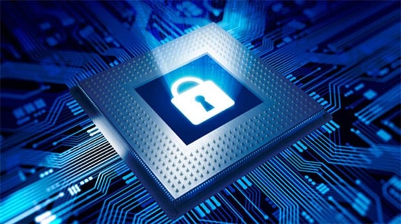 Close up of a lock inside a circuit board, which is meant to symbolize cybersecurity.