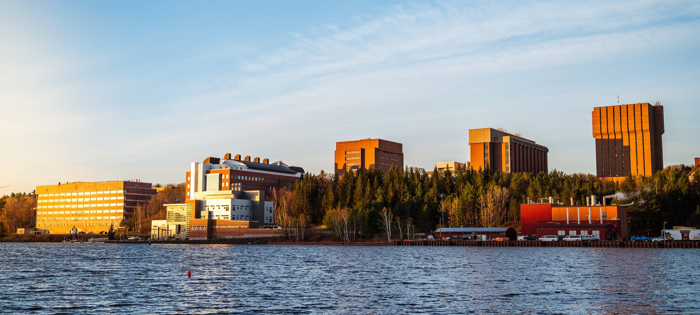 Vista of the MTU campus on the water on a sunny Fall day.