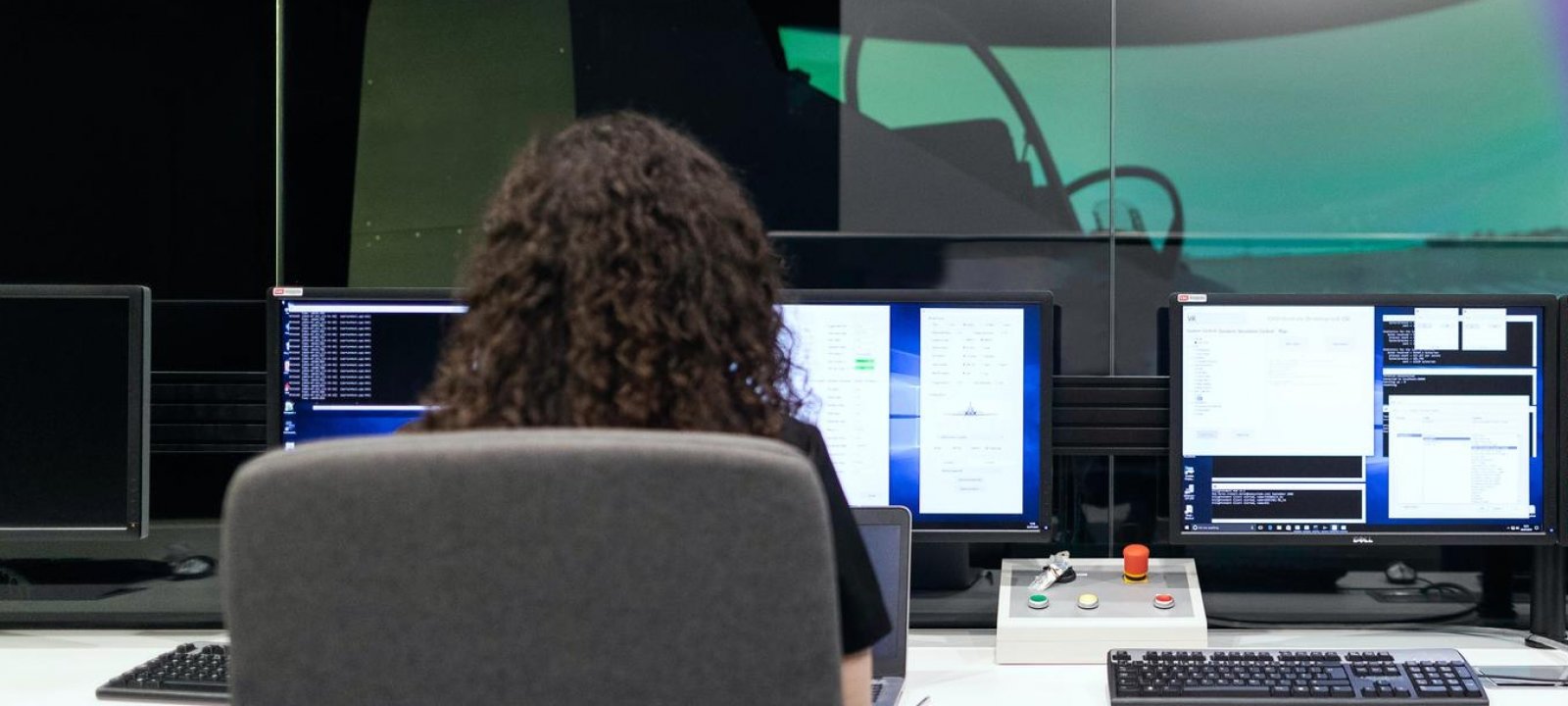 A female engineer with a laptop working on a GIS problem.