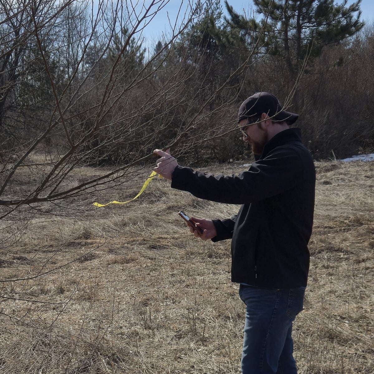 James Miller out in the field doing work.