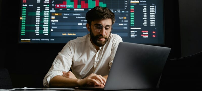 An investment analyst at work on a planning report.