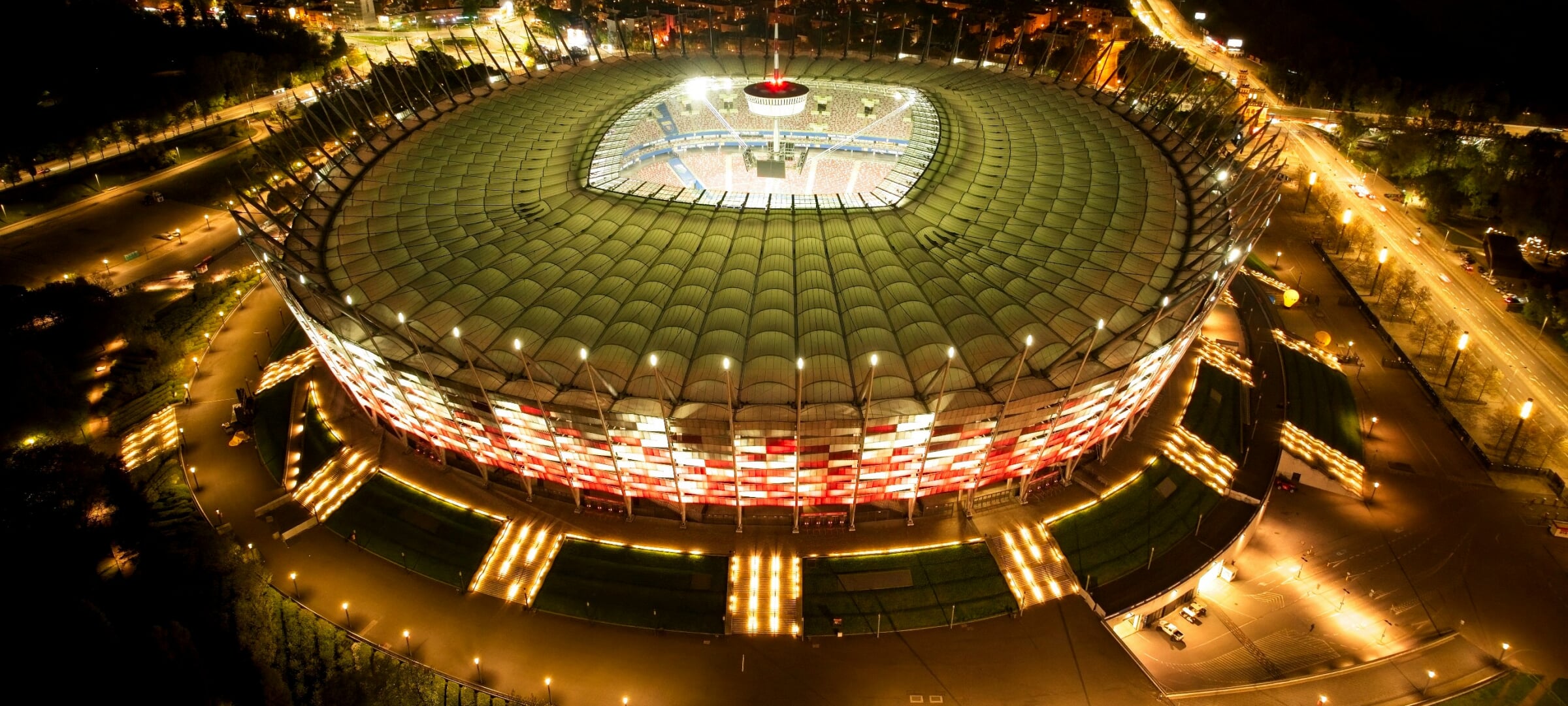 Overhead image of a sports stadium lit up at night.