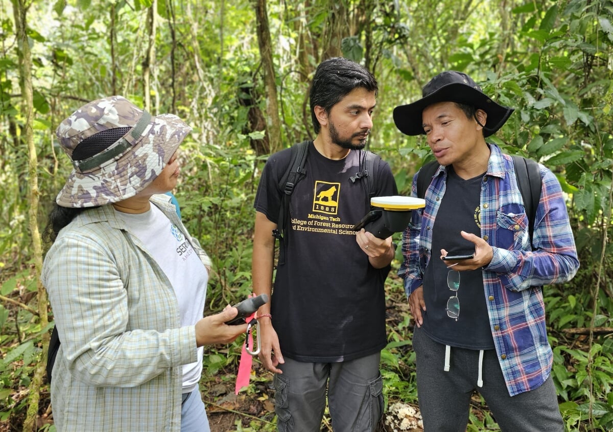 Parth Bhatt in the field with two GIS workshop participants while in Suriname.