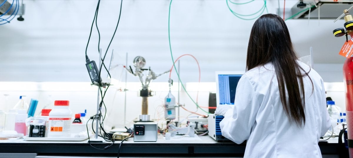 Woman with an advanced degree working in an engineering lab.