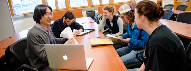 Faculty member teaching computer science students.