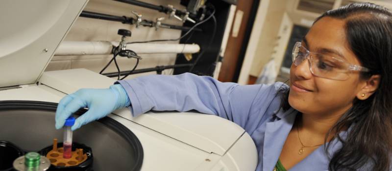 Student working with a centrifuge