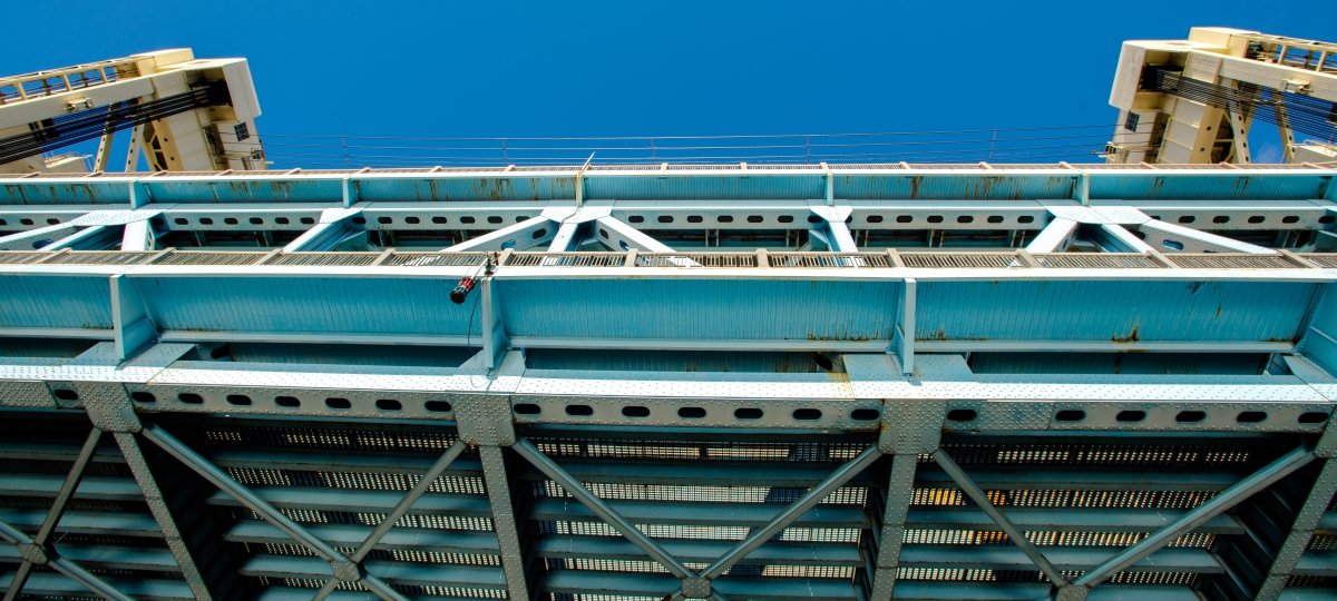 View looking up from the water from underneath the Portage Lift Bridge