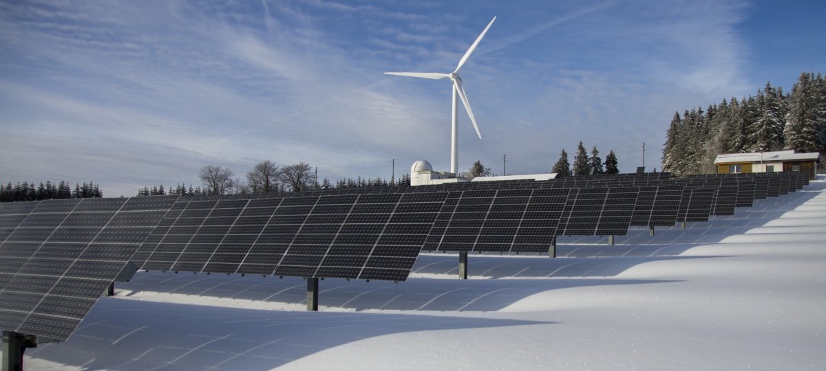 Solar panels and wind turbine in winter