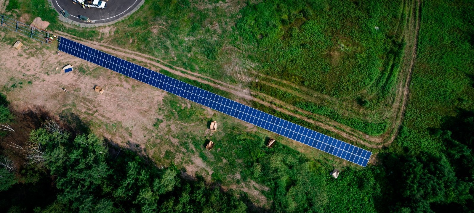 Aerial of solar panels in a field