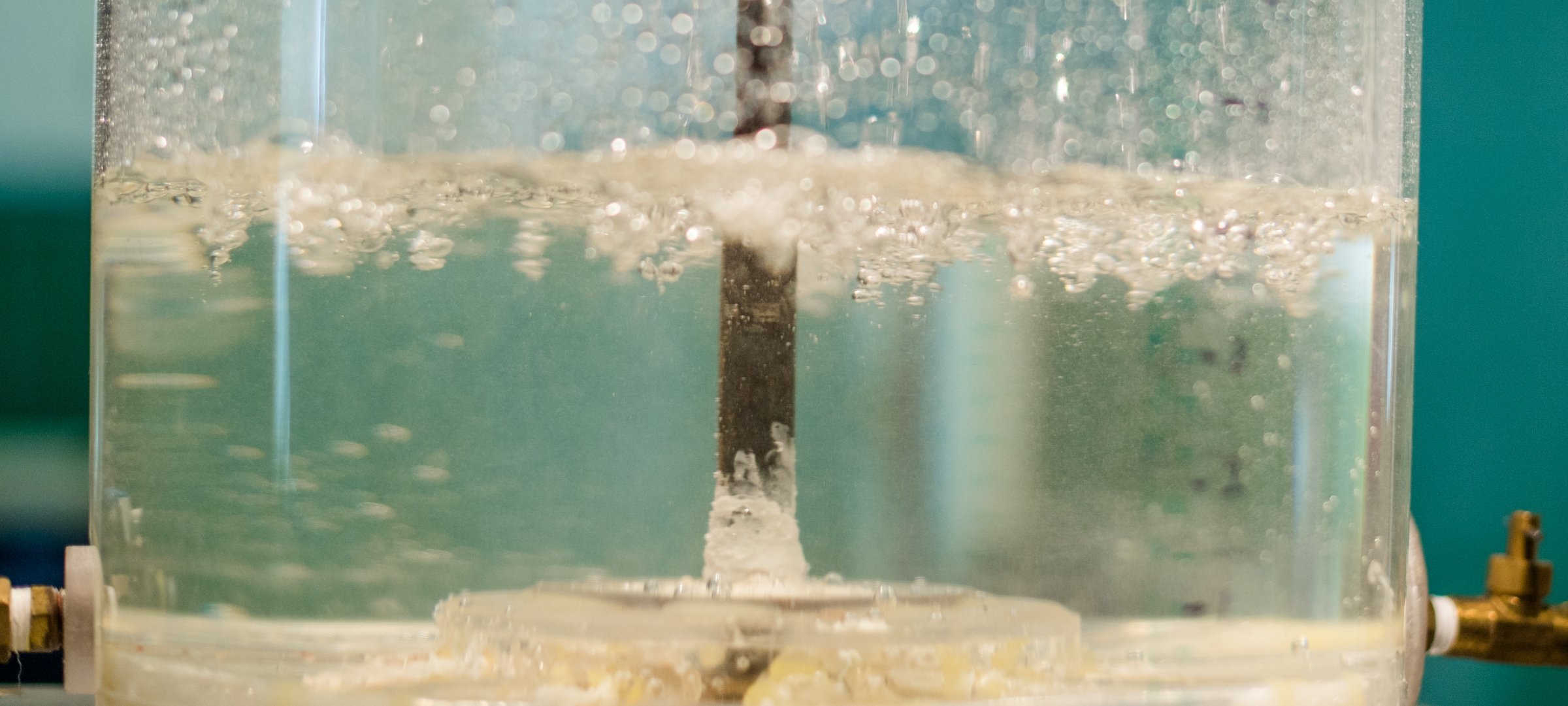 Water boiling in a beaker.