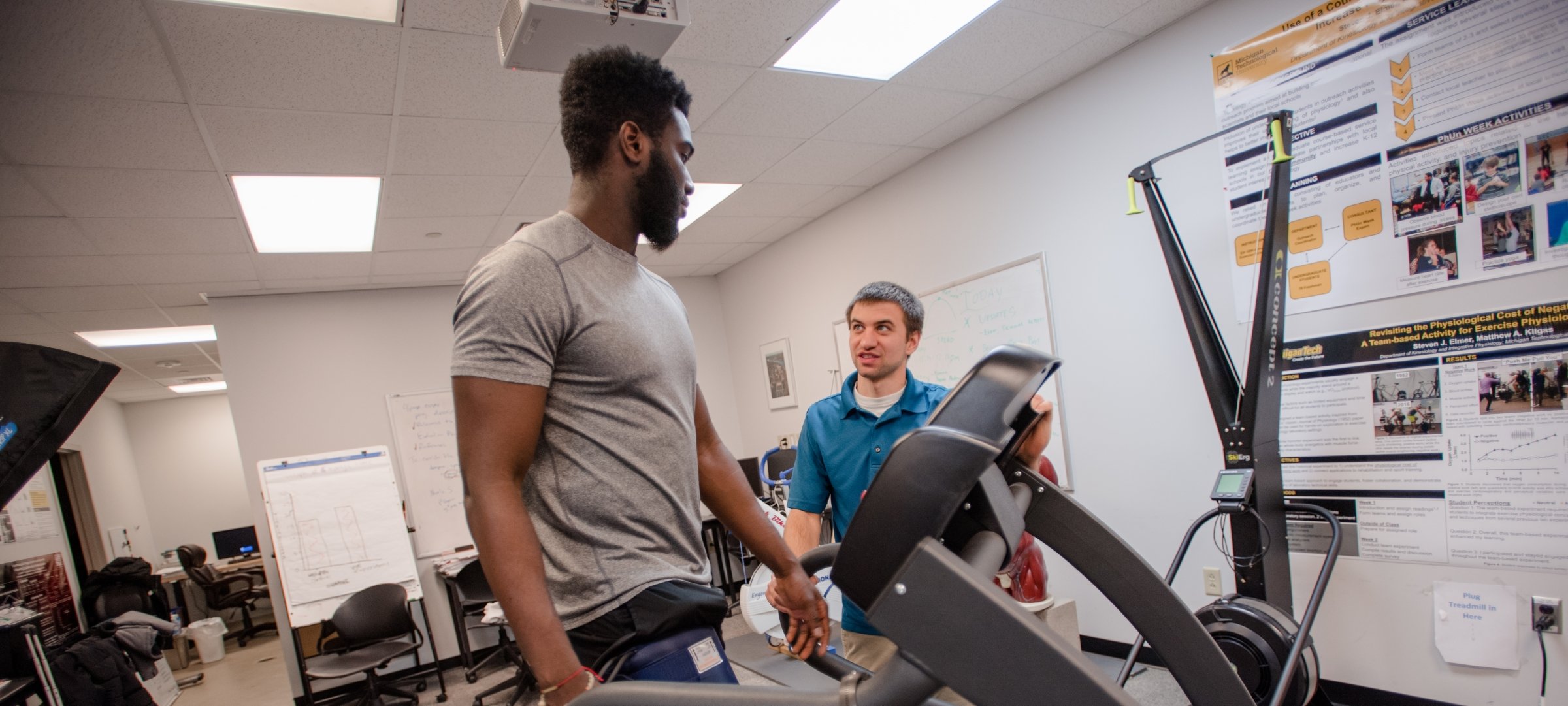 Kinesiology student running an exercise test with researcher