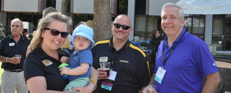 Alumnae and staff member Erin Jarvi introduces a future Michigan Tech student to Alumni Reunion.