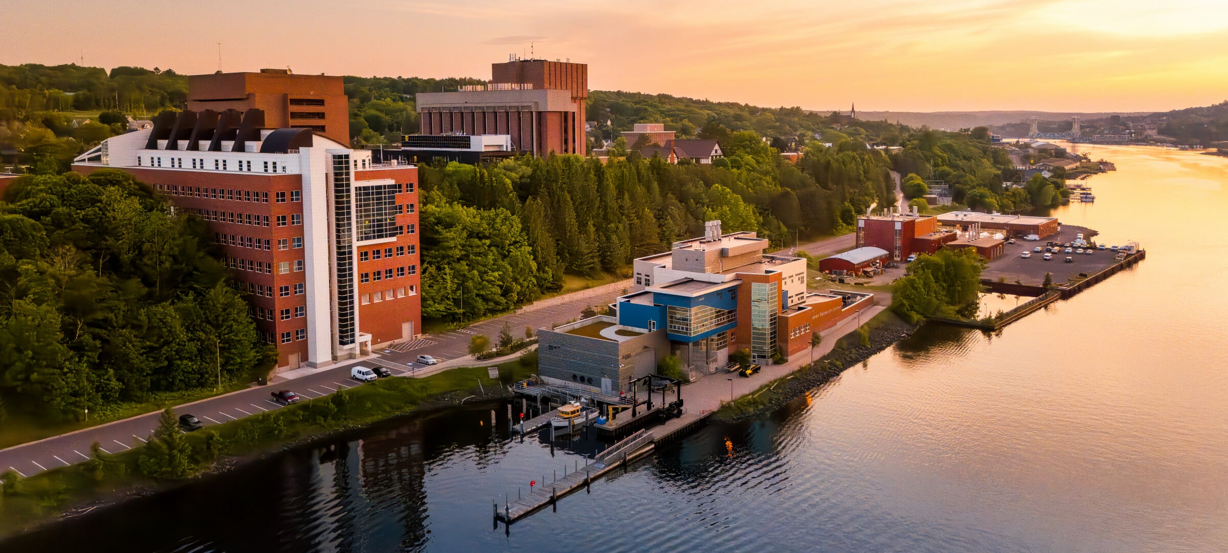 Great Lakes Research Center building on the Portage Canal at sunset