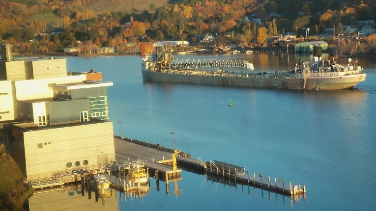 A large boat driving past the GLRC dock.