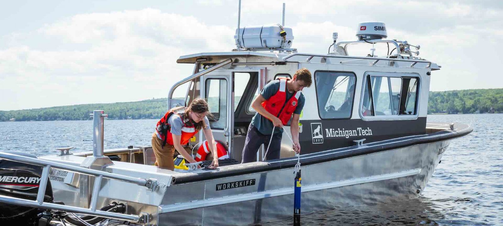 MTU Soliton boat on the water with two passengers