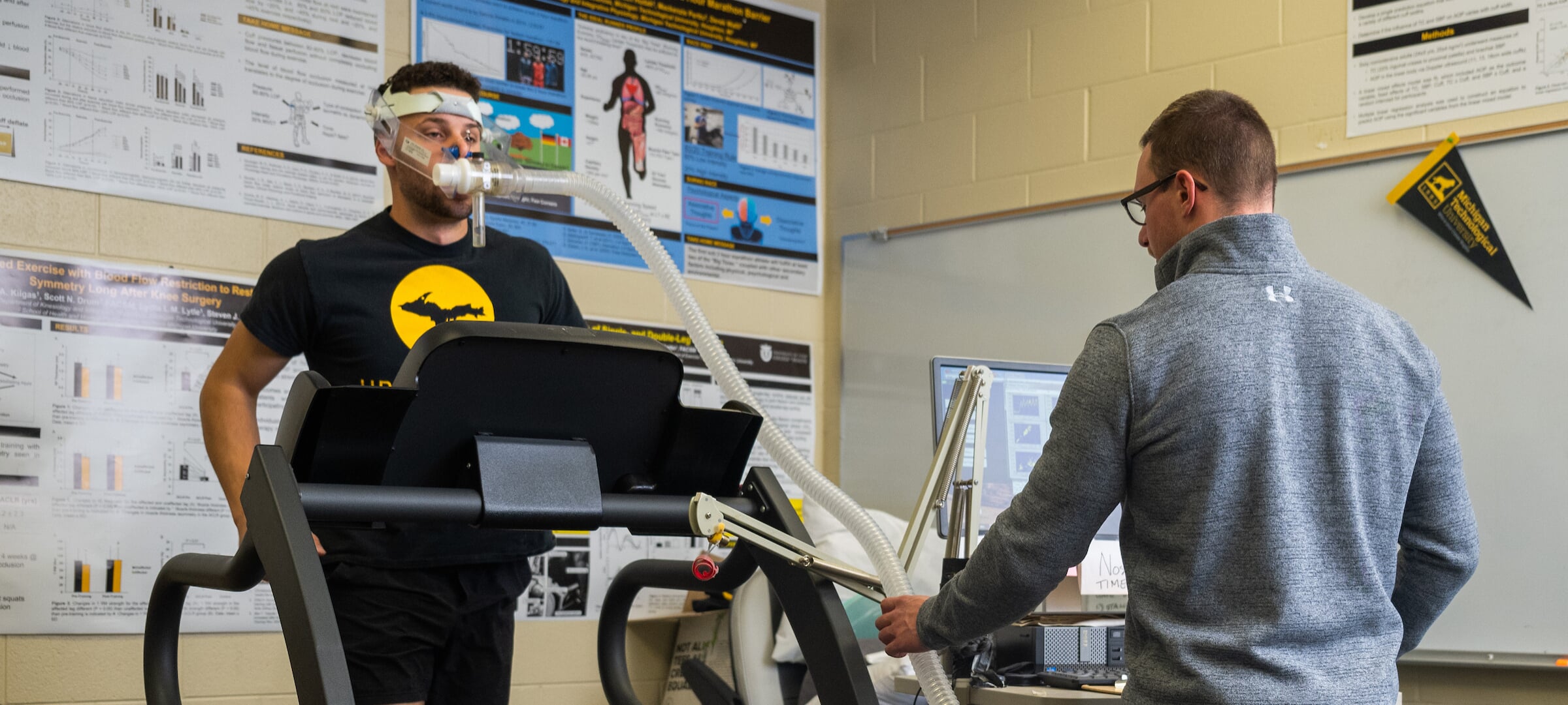 Research measuring monitor and participant walks on a treadmill with breathing aparatus