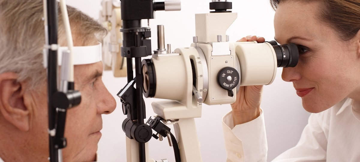 A doctor administers an eye test