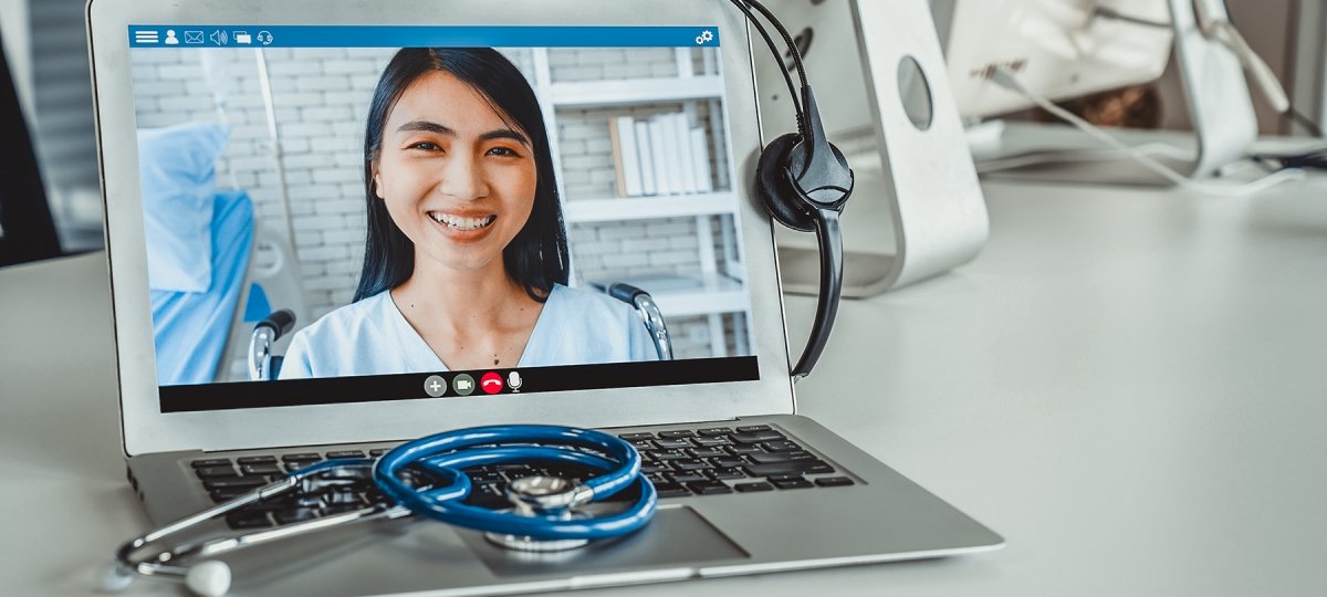 A woman's image on a relehealth laptop