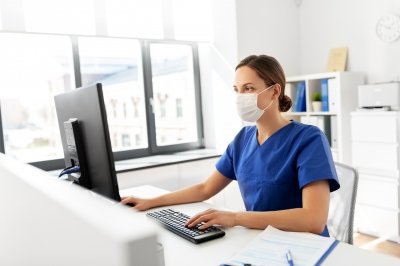 Healthcare professional at computer