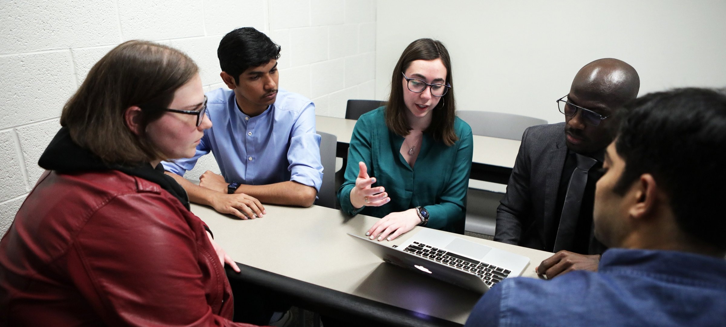 Health Informatics master's students discuss an assignment