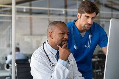 Healthcare professionals consider information on a computer