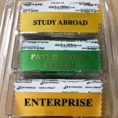 Name tag add-ons reading Study Abroad, Pavlis Honors College, and Enterprise