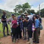 a group of students learning to fly a drone