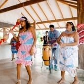 Suriname local community members dancing in colorful clothes