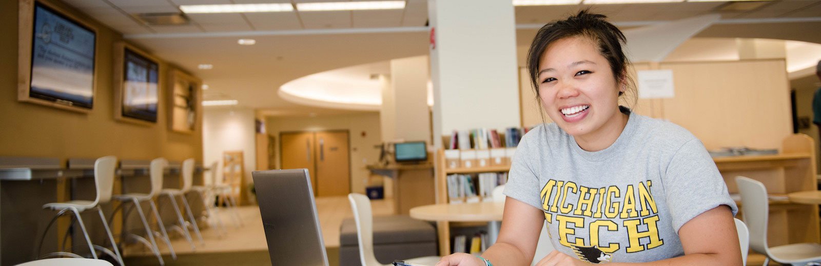Michigan Tech student studying at the library