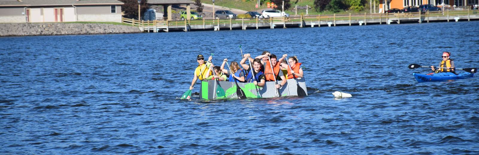 Pavlis students competing in Michigan Tech's Homecoming cardboard boat race