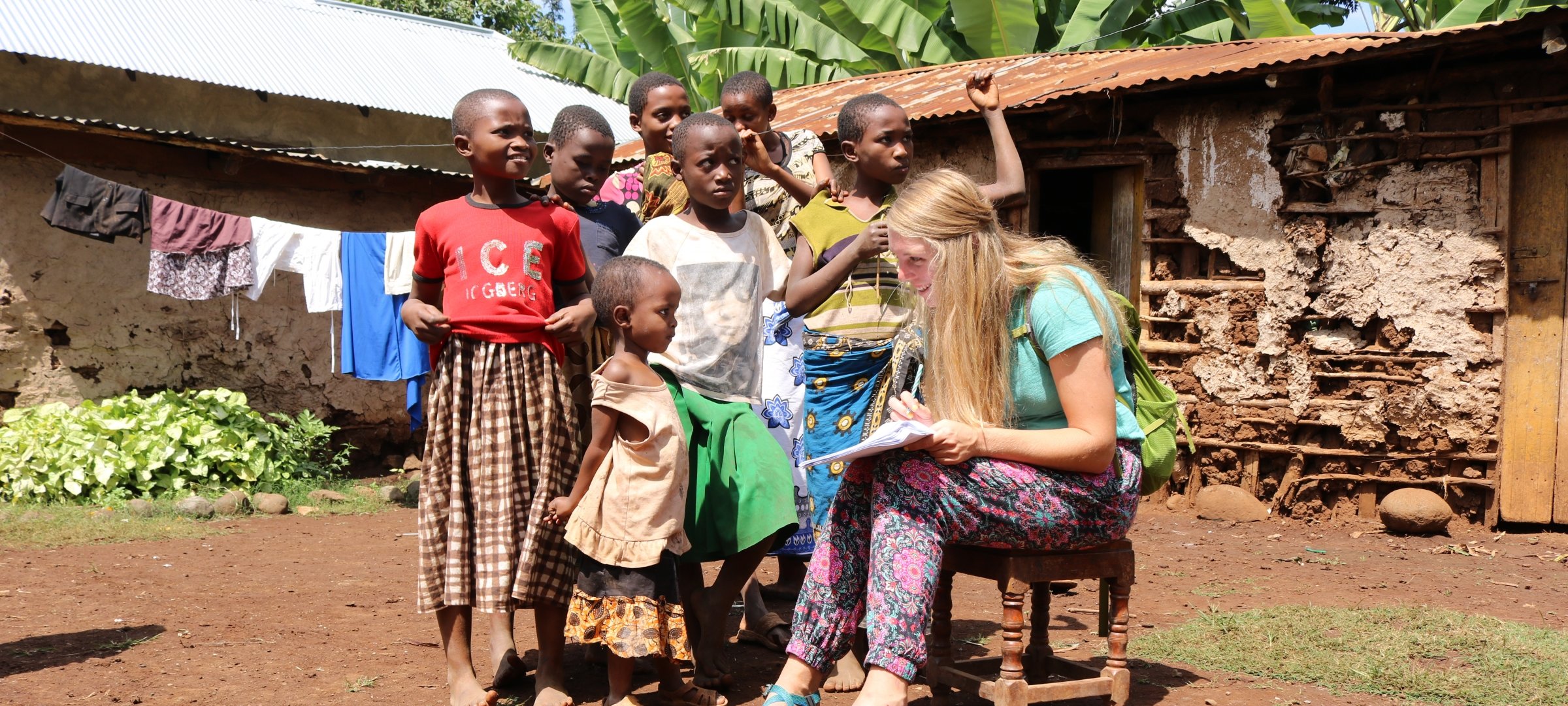 A Pavlis Honors student reading to kids on a Global Leadership trip.