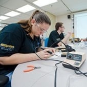 Students using equipment in a lab.