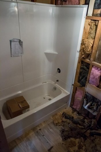 Bathtub in a room being renovated.