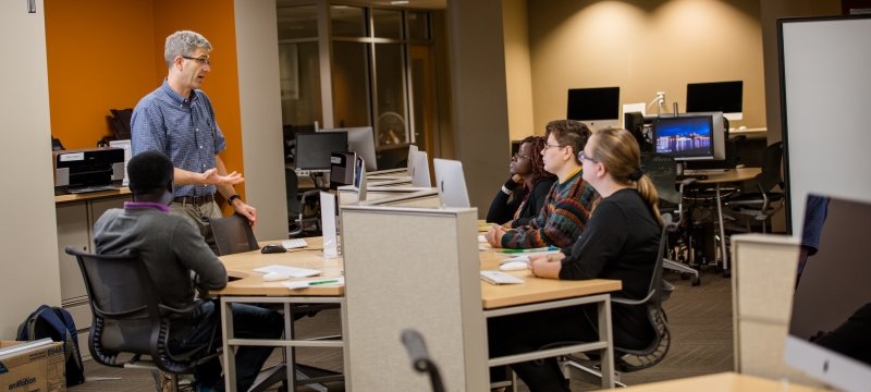 Inside HDMZ with faculty standing and some students