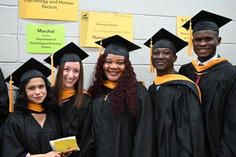 2026 Master's graduates in their caps and gowns.