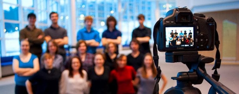 From behind the camera, HDMZ students get their picture taken inside the Rozsa Center for the Performing Arts.