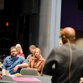 Guests listen to a seminar speaker. 