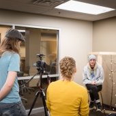 Faculty member gives an on-camera interview for a documentary.