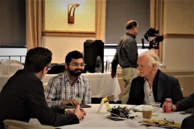 Computing MTU Showcase table with Dennis Livesay, Dave House, and Student