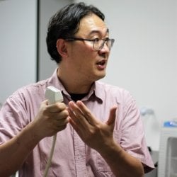 Jingfeng Jiang holds an ultrasound probe