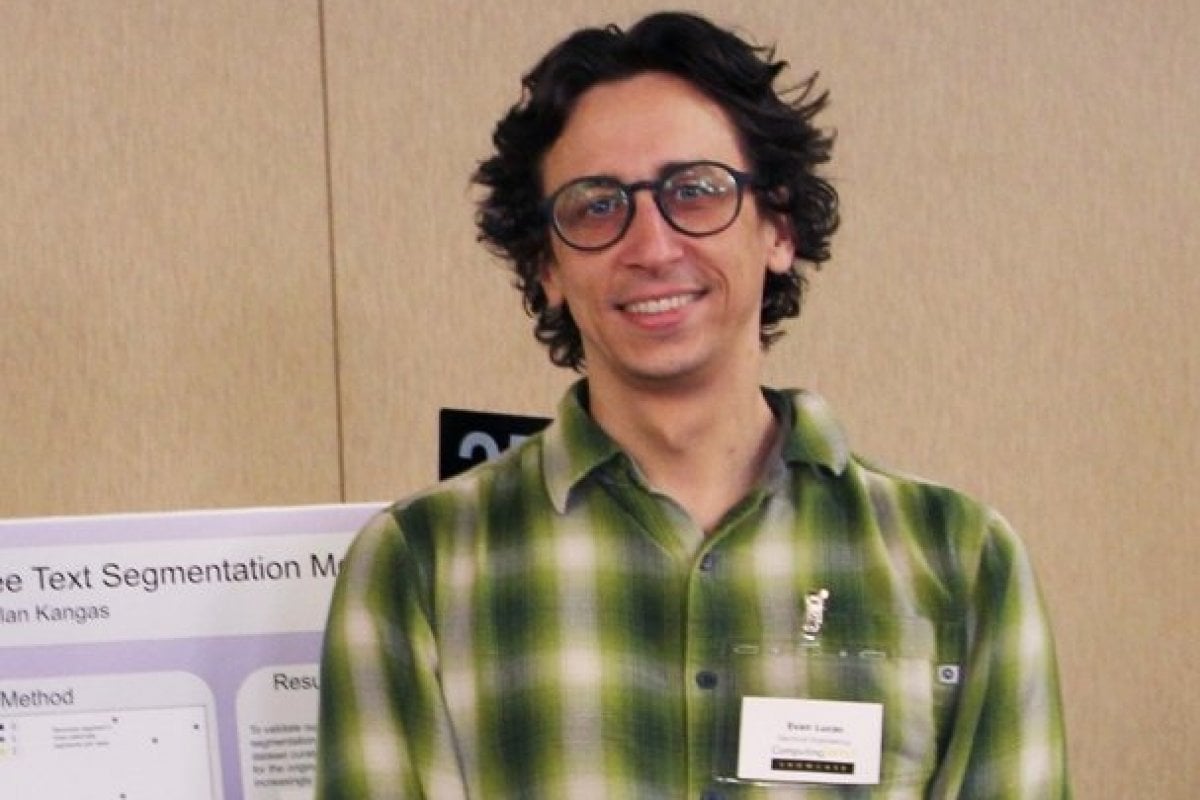 Evan Lucas at the student poster competition before completing his PhD