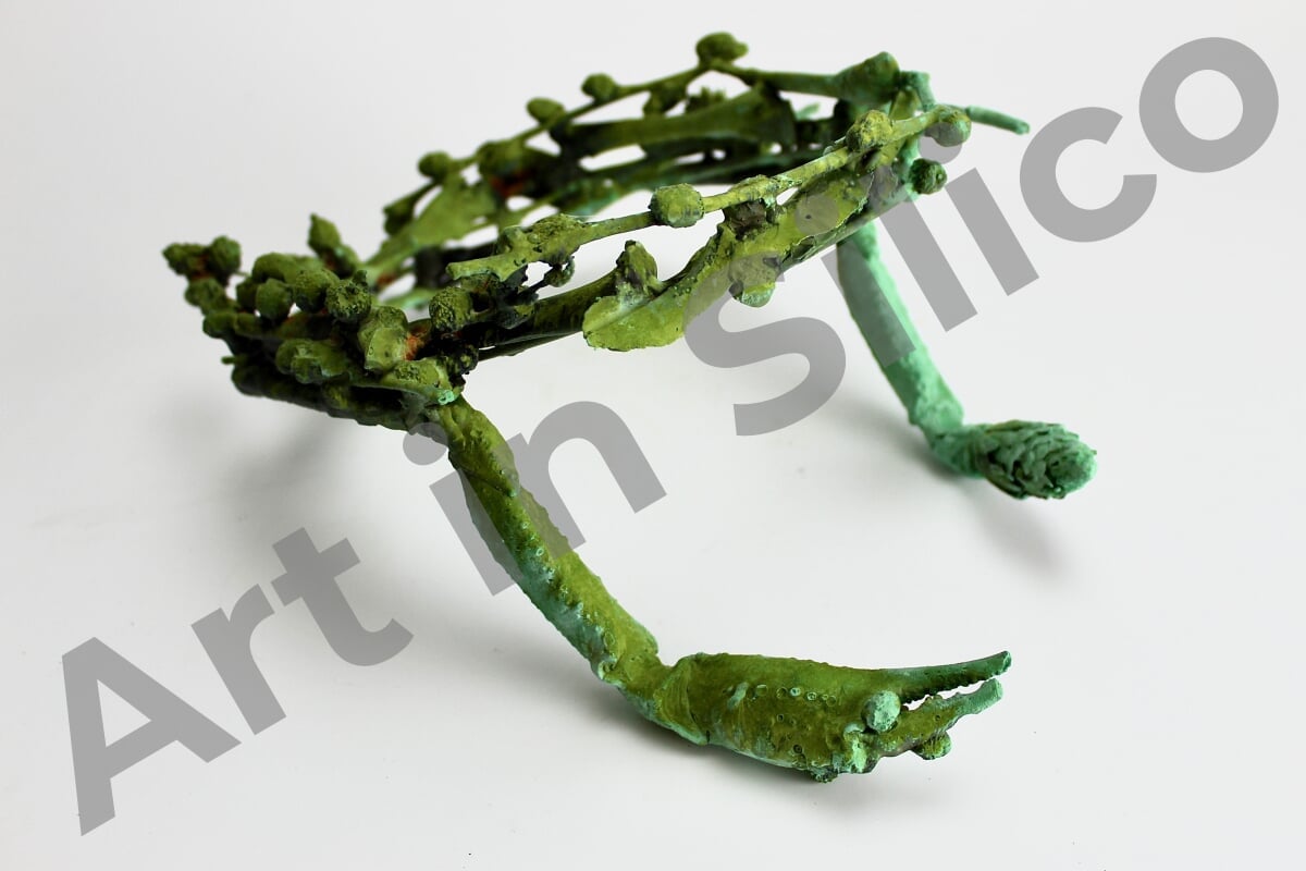 This artwork is a crustacean and plants in the shape of a bronze crown 