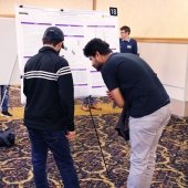 Students discussing posters
