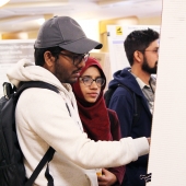 Students discussing posters