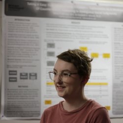 PhD student Betsy Lehmann with research poster