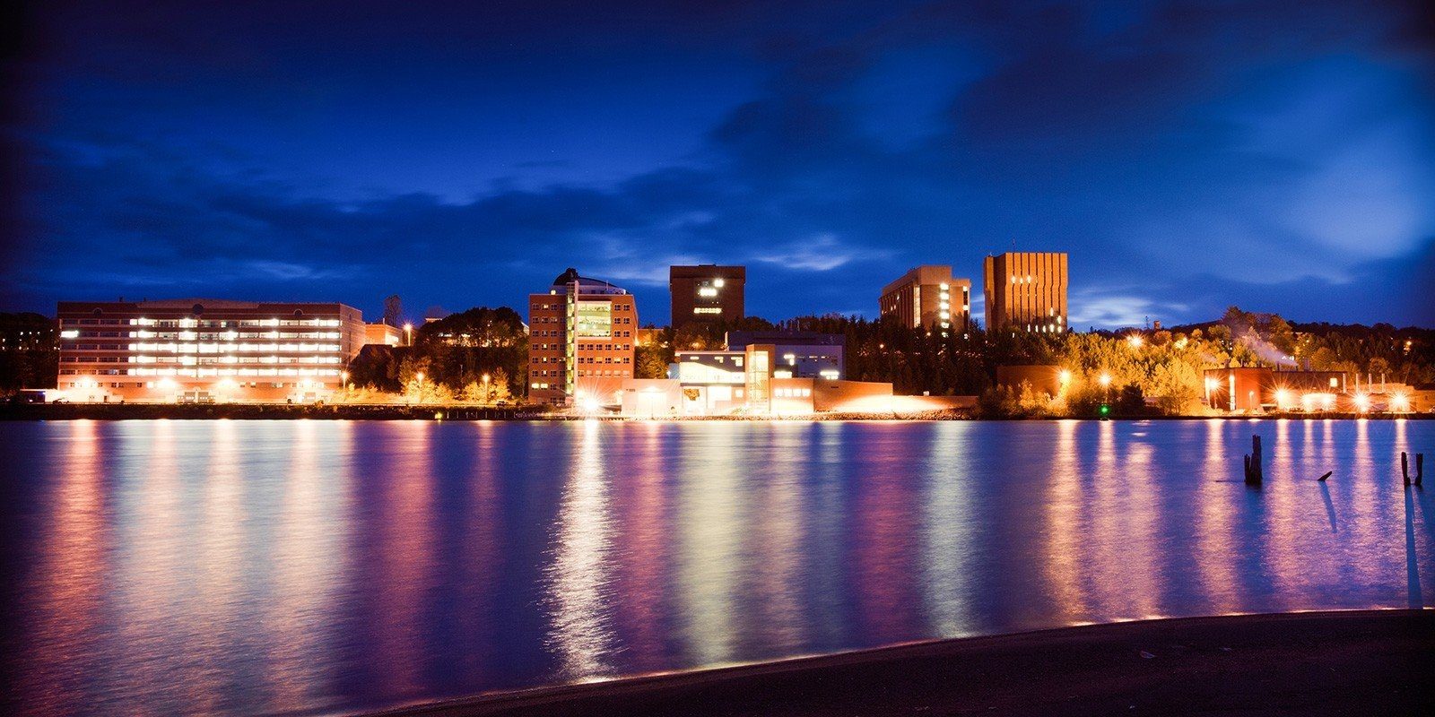 View of campus from across the canal at night.