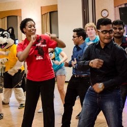 International students and staff dancing